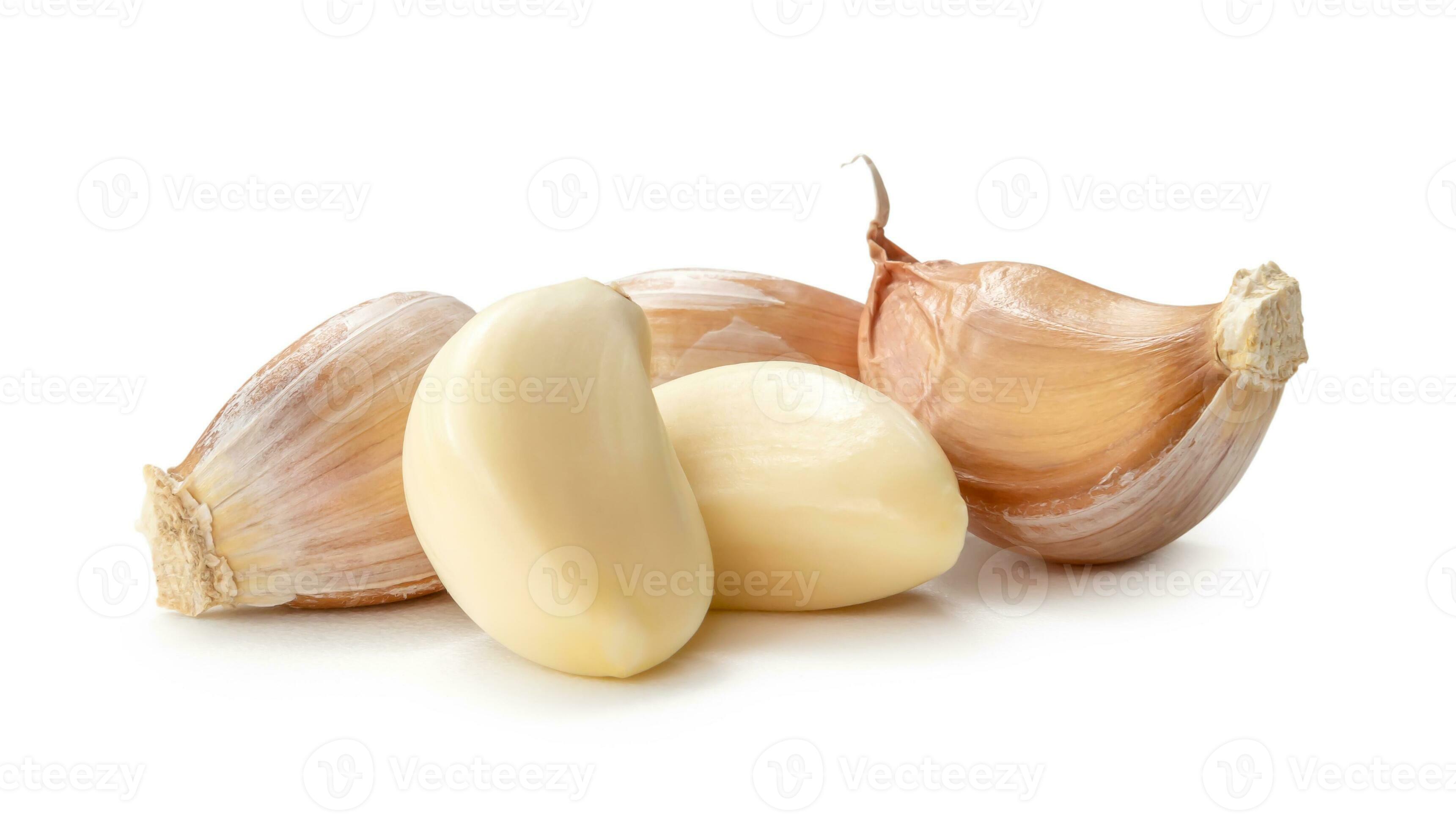 Fresh three garlic cloves in stack isolated on white background with