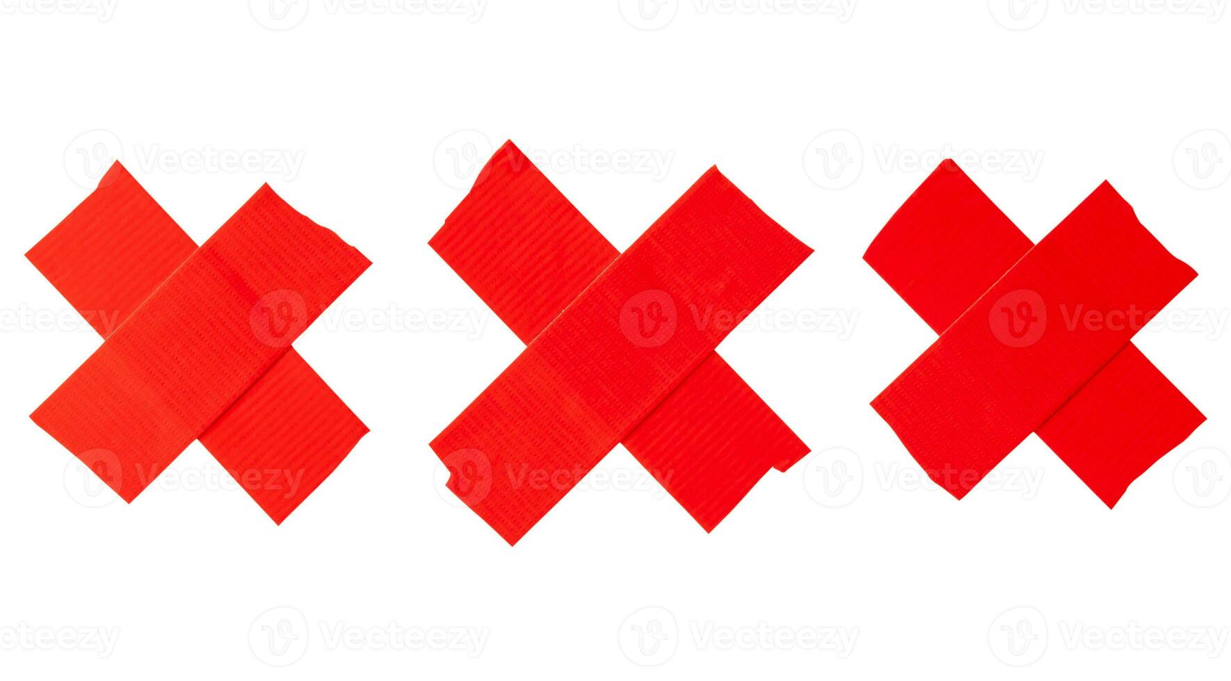 Set of red scotch tape or adhesive vinyl tape in stripe of crisscross shape isolated on white background with clipping path photo