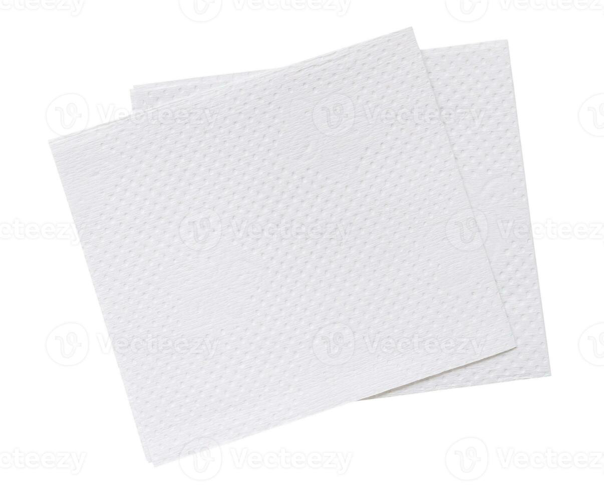 Top view of two folded pieces of white tissue paper or napkin in stack isolated on white background with clipping path photo