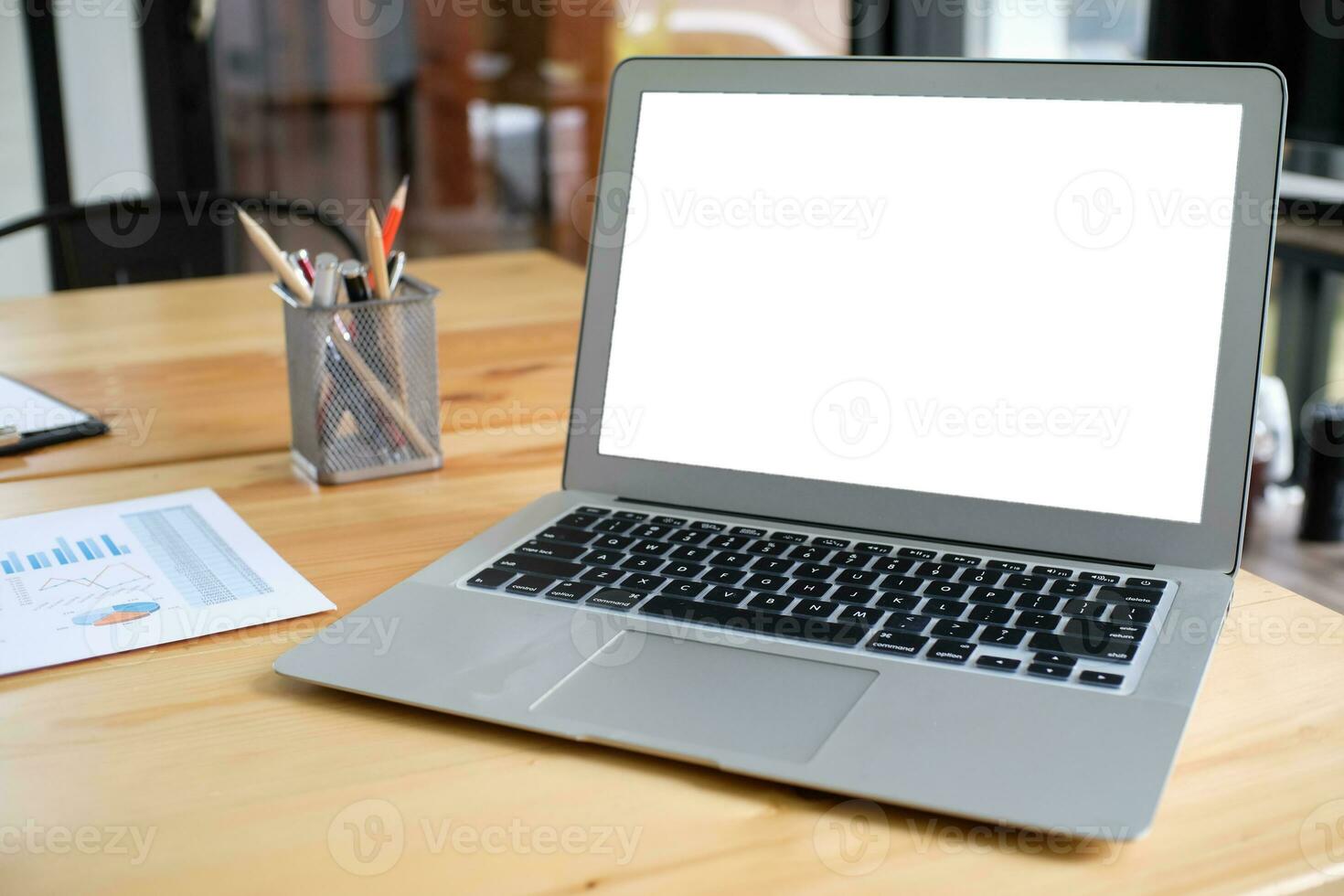 Laptop with Mock up blank screen on wooden table in front of cafe space for text. product display computer laptop montage- technology Freelance work photo