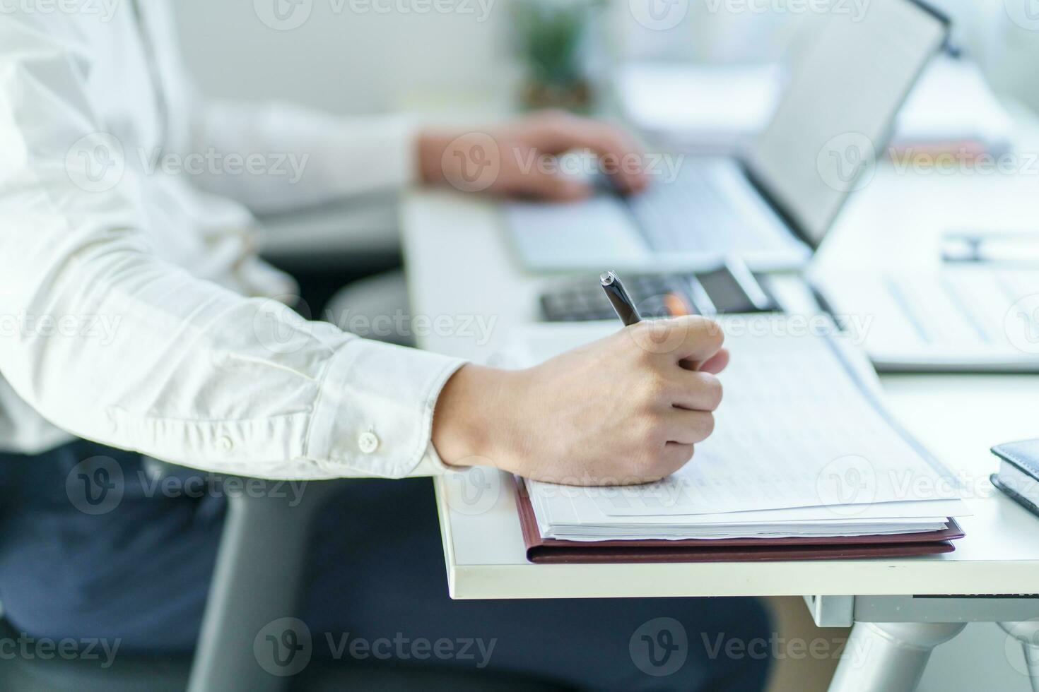 Business man working using laptop computer Hands typing keyboard. Professional investor working start up project. business planning in office. Technology business Concept photo