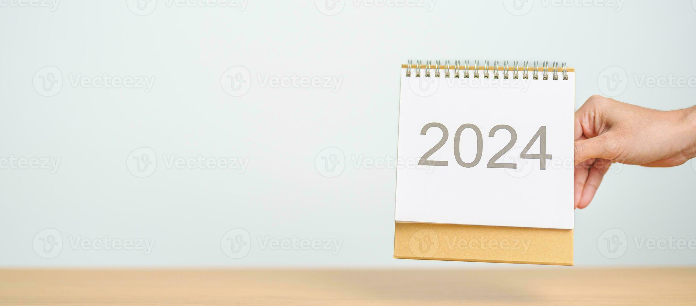 2024 Year Calendar on table background. Happy New Year, Resolution, Goals, Plan,  Action, Mission and financial Concept photo