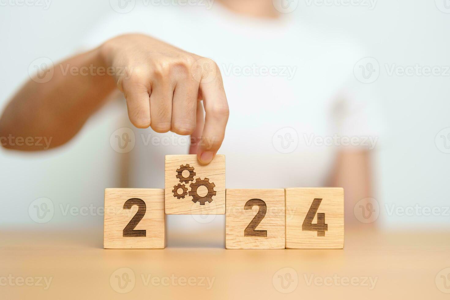 2024 block with gear icon. Business Process, Team, teamwork, Goal, Target, Resolution, strategy, plan, Action, motivation, change, brainstorm and New Year start concepts photo