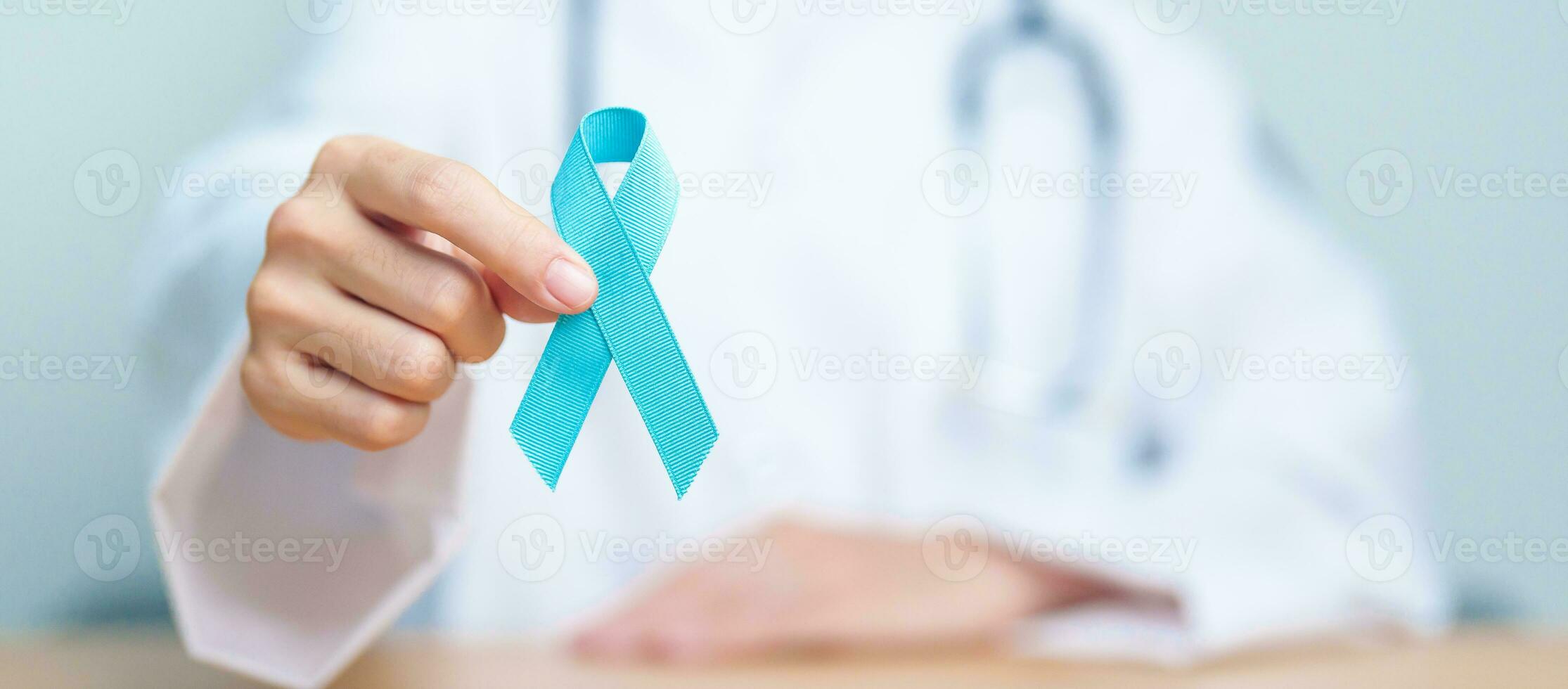 Blue November Prostate Cancer Awareness month, Doctor with Blue Ribbon in hospital for support people life and illness. Healthcare, International men, Father, Diabetes and World cancer day photo