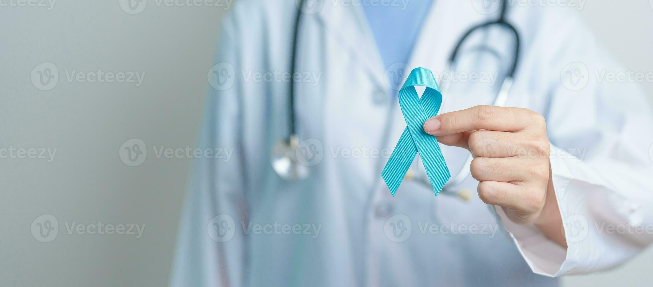 Blue November Prostate Cancer Awareness month, Doctor with Blue Ribbon in hospital for support people life and illness. Healthcare, International men, Father, Diabetes and World cancer day photo