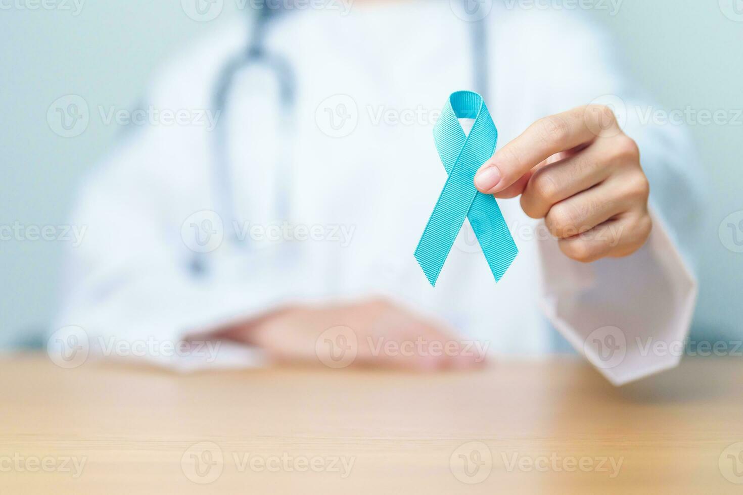 Blue November Prostate Cancer Awareness month, Doctor with Blue Ribbon in hospital for support people life and illness. Healthcare, International men, Father, Diabetes and World cancer day photo