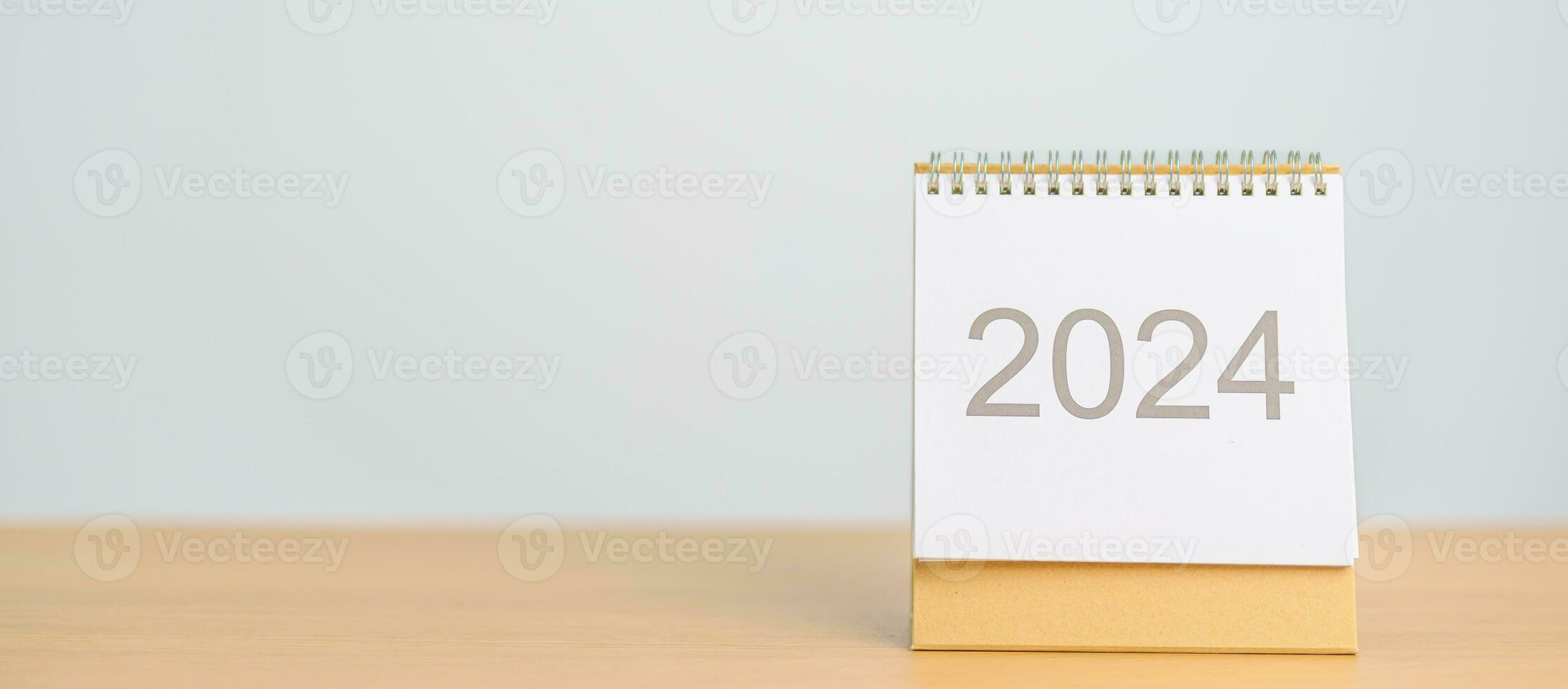 2024 Year Calendar on table background. Happy New Year, Resolution, Goals, Plan,  Action, Mission and financial Concept photo