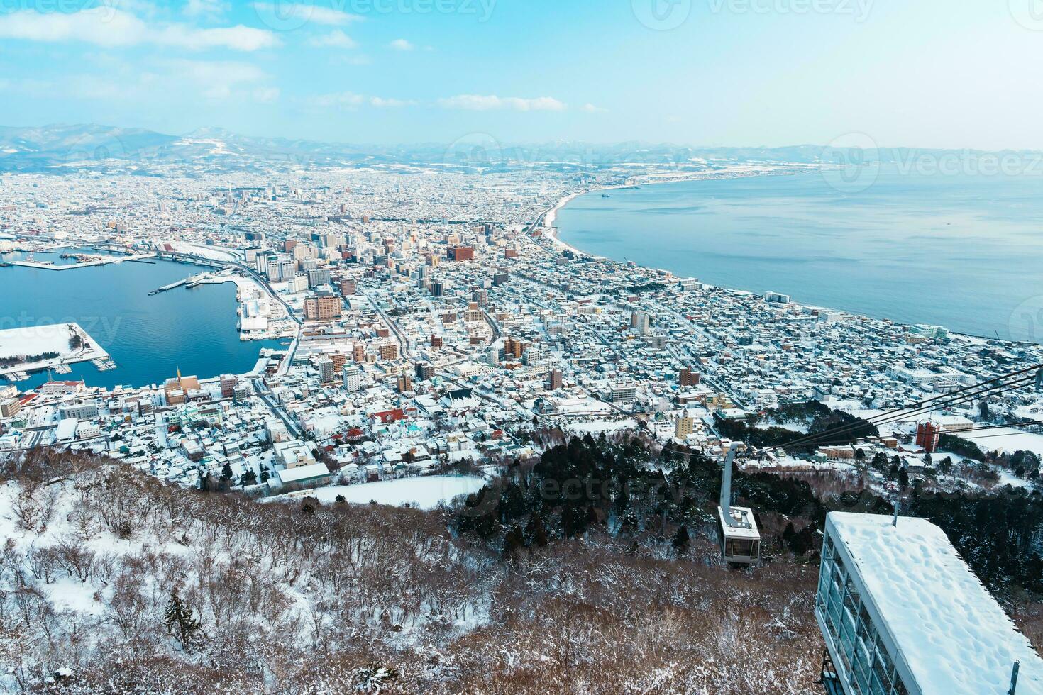 Beautiful landscape and cityscape from Hakodate Mountain with Snow in winter season. landmark and popular for attractions in Hokkaido, Japan.Travel and Vacation concept photo