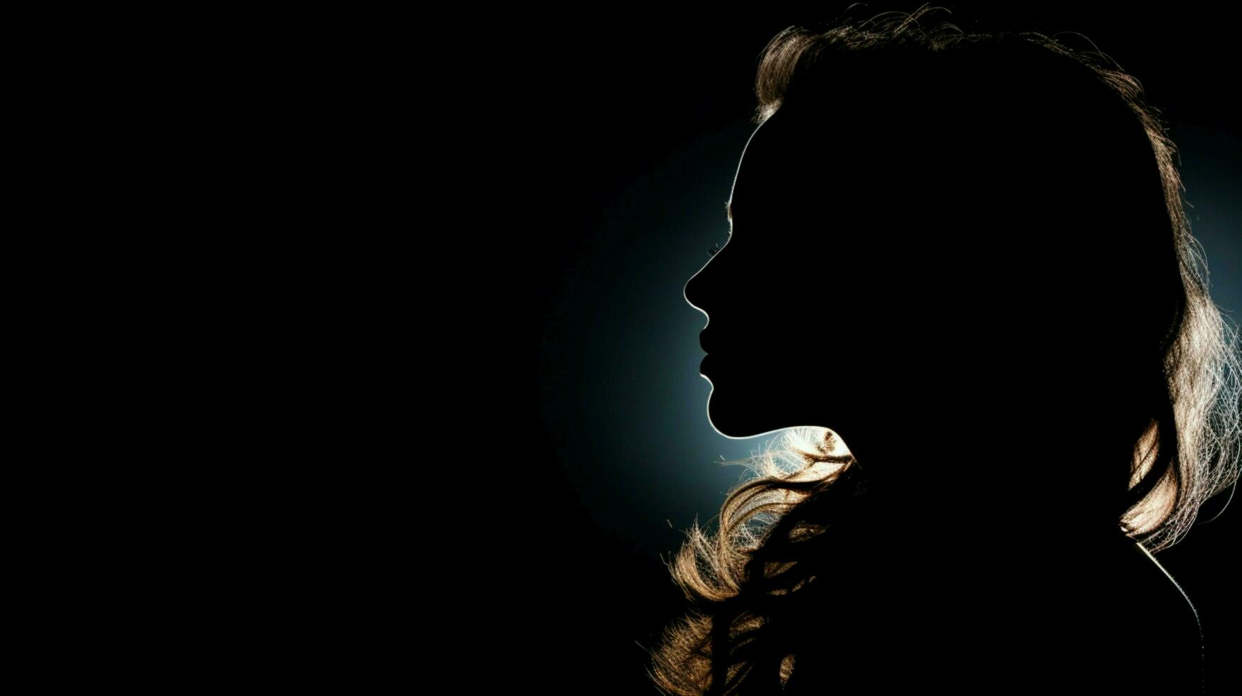 silhouette portrait of young adult woman looking mysterious photo