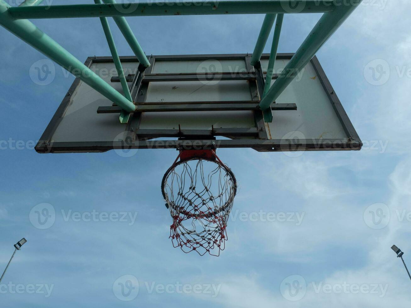 sport basketball hoop basket game competition ball net equipment game team goal blue sky cloud background top view score activity shot court recreation ring orange stadium championship play symbol win photo