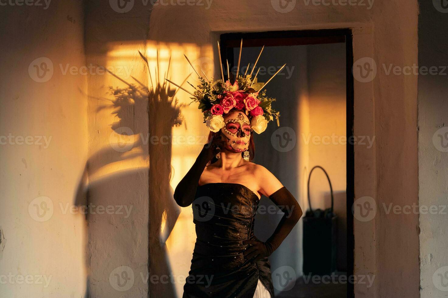 Portrait of a girl with sugar skull makeup over black background. Calavera Catrina. Dia de los muertos. Day of The Dead. Halloween. photo