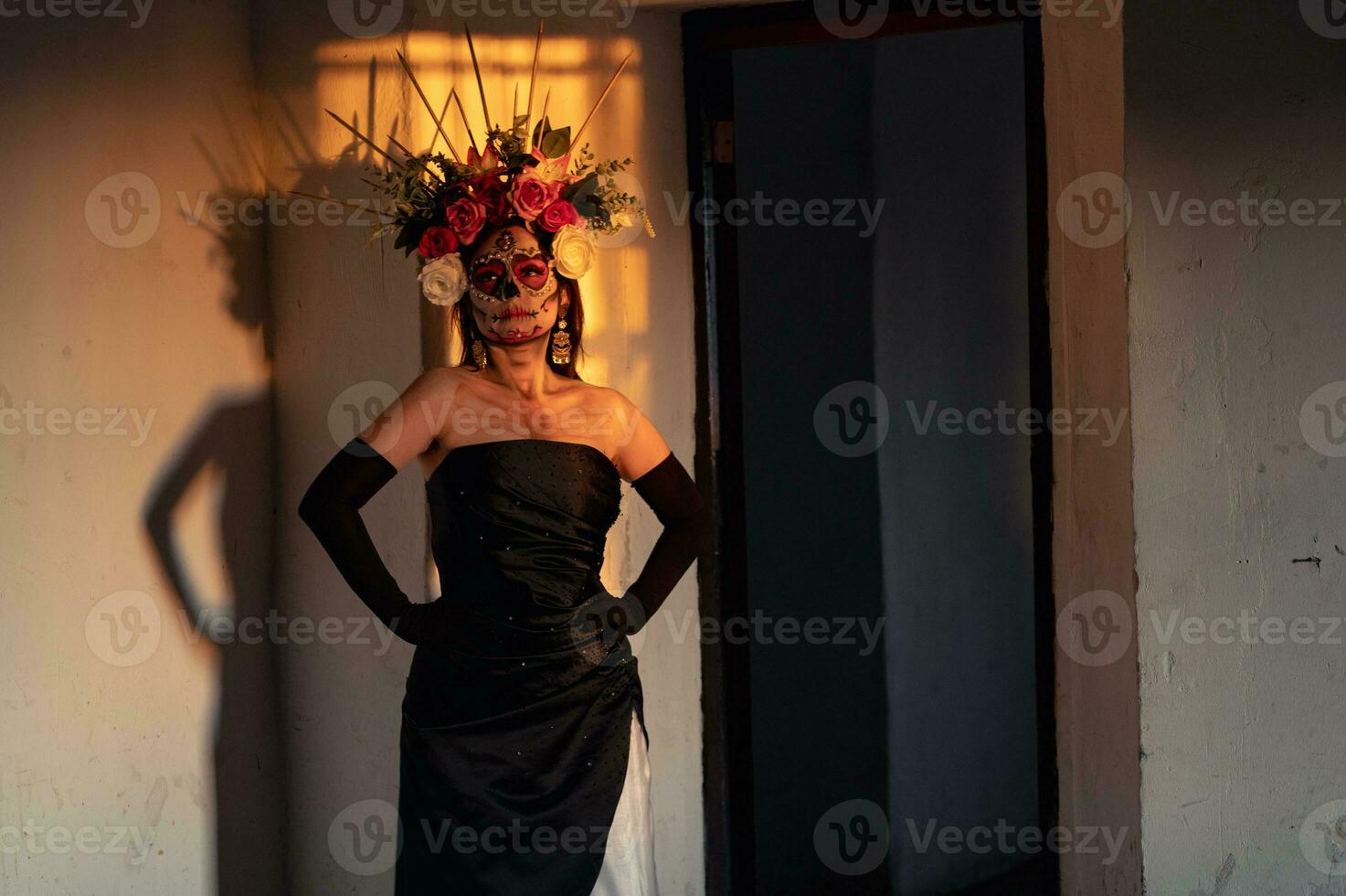 Portrait of a girl with sugar skull makeup over black background. Calavera Catrina. Dia de los muertos. Day of The Dead. Halloween. photo