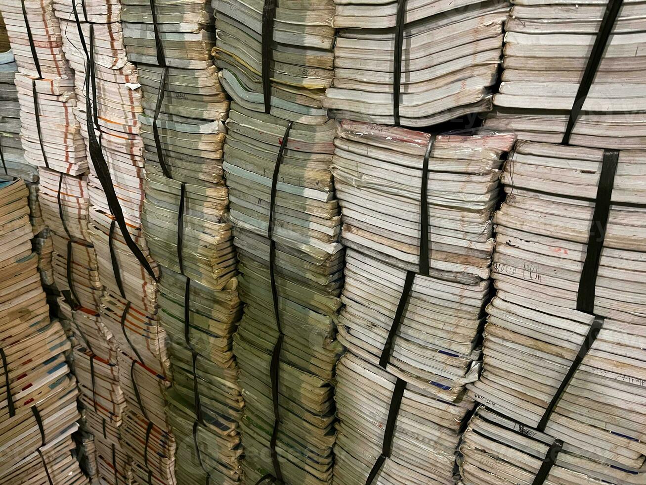 stack of books, pile of books background Many Books Piles. Hardback books on wooden table. Back to school. old book photo