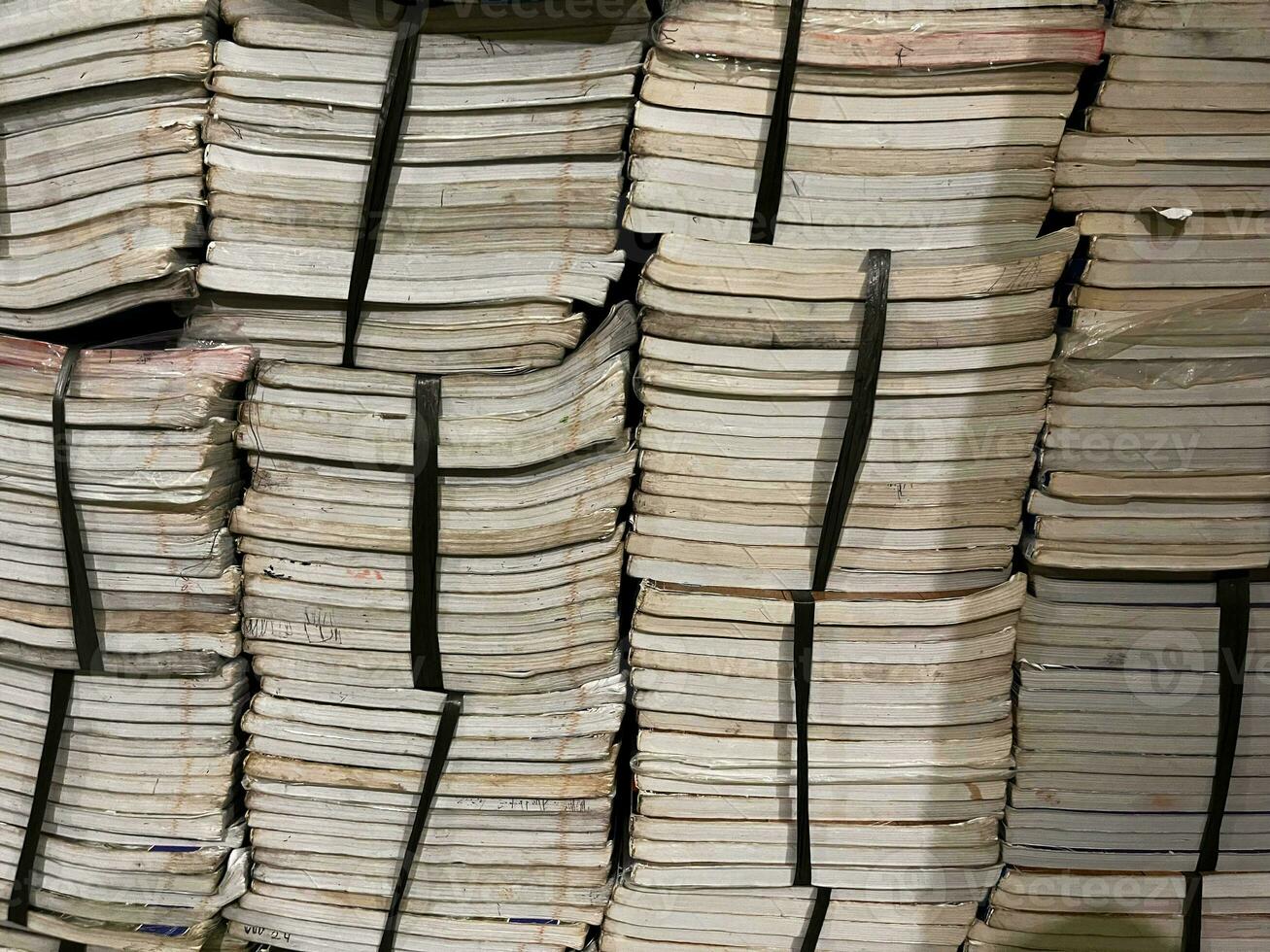 stack of books, pile of books background Many Books Piles. Hardback books on wooden table. Back to school. old book photo