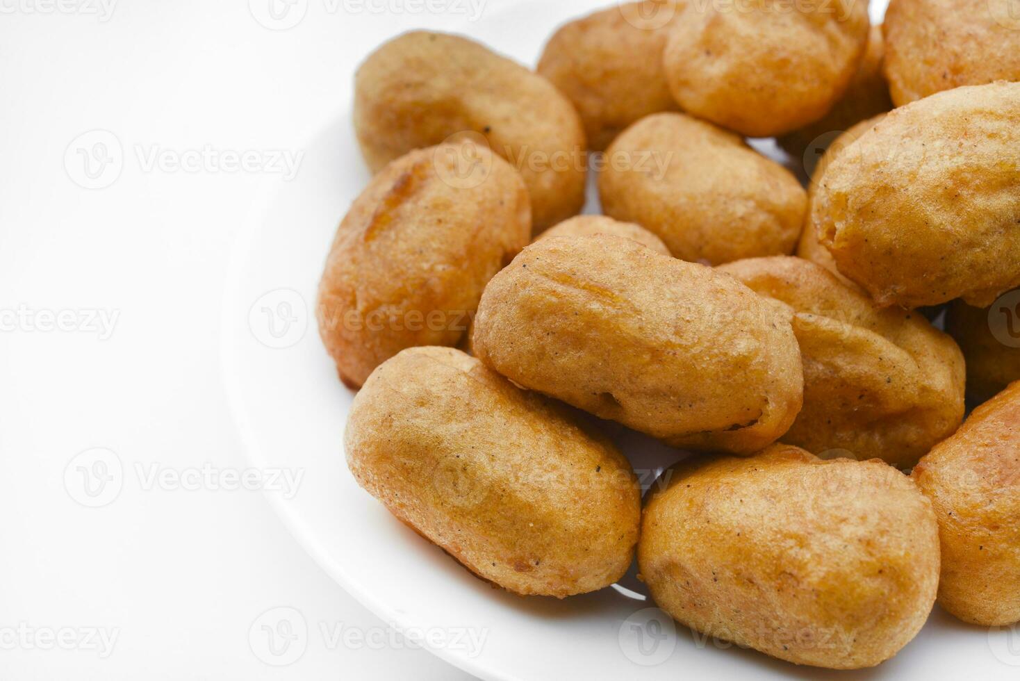 Sausages in dough on a white plate. Delicious meat appetizer in batter. photo