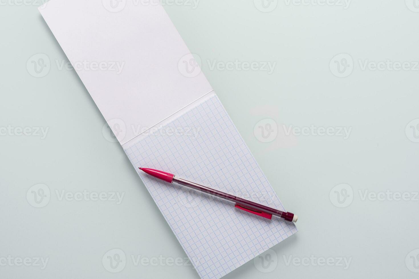 Top view of blank notebook with pencil on white background photo