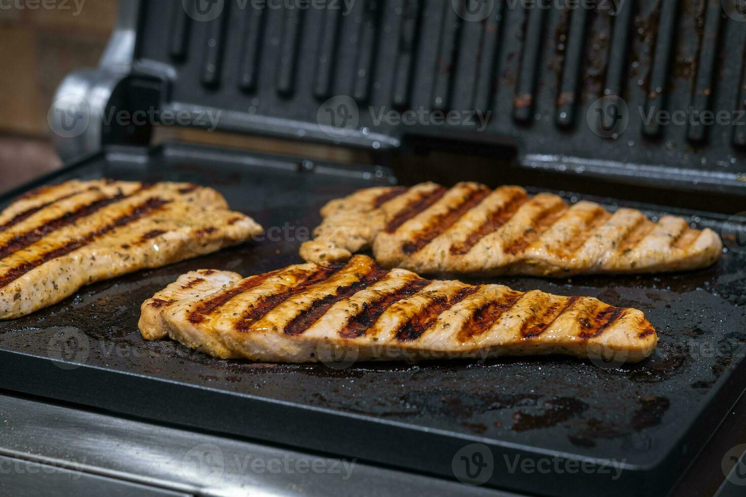 Turkey fillet steaks grilled in the home kitchen. Horizontal orientation photo