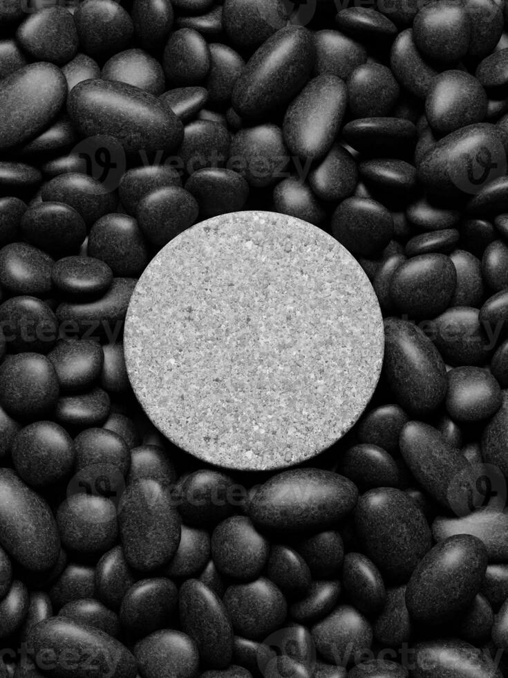 3d round display podium on the pebbles. 3d rendering of realistic presentation for product advertising. 3d minimal illustration. photo