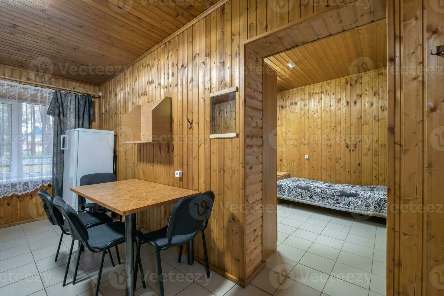 table with chairs in entrance hall in wooden country eco house photo