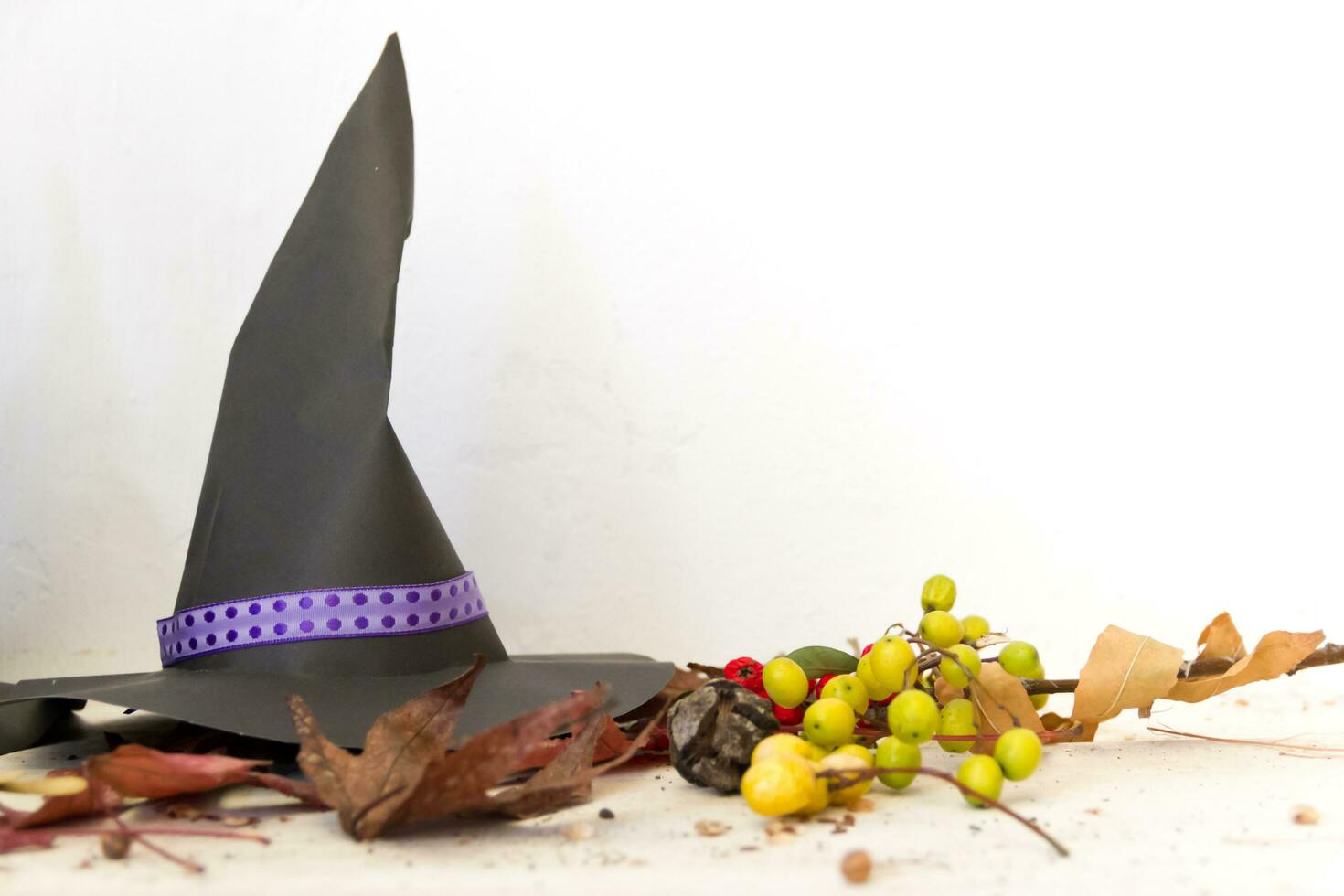 decoration with witch hats and autumn for halloween photo