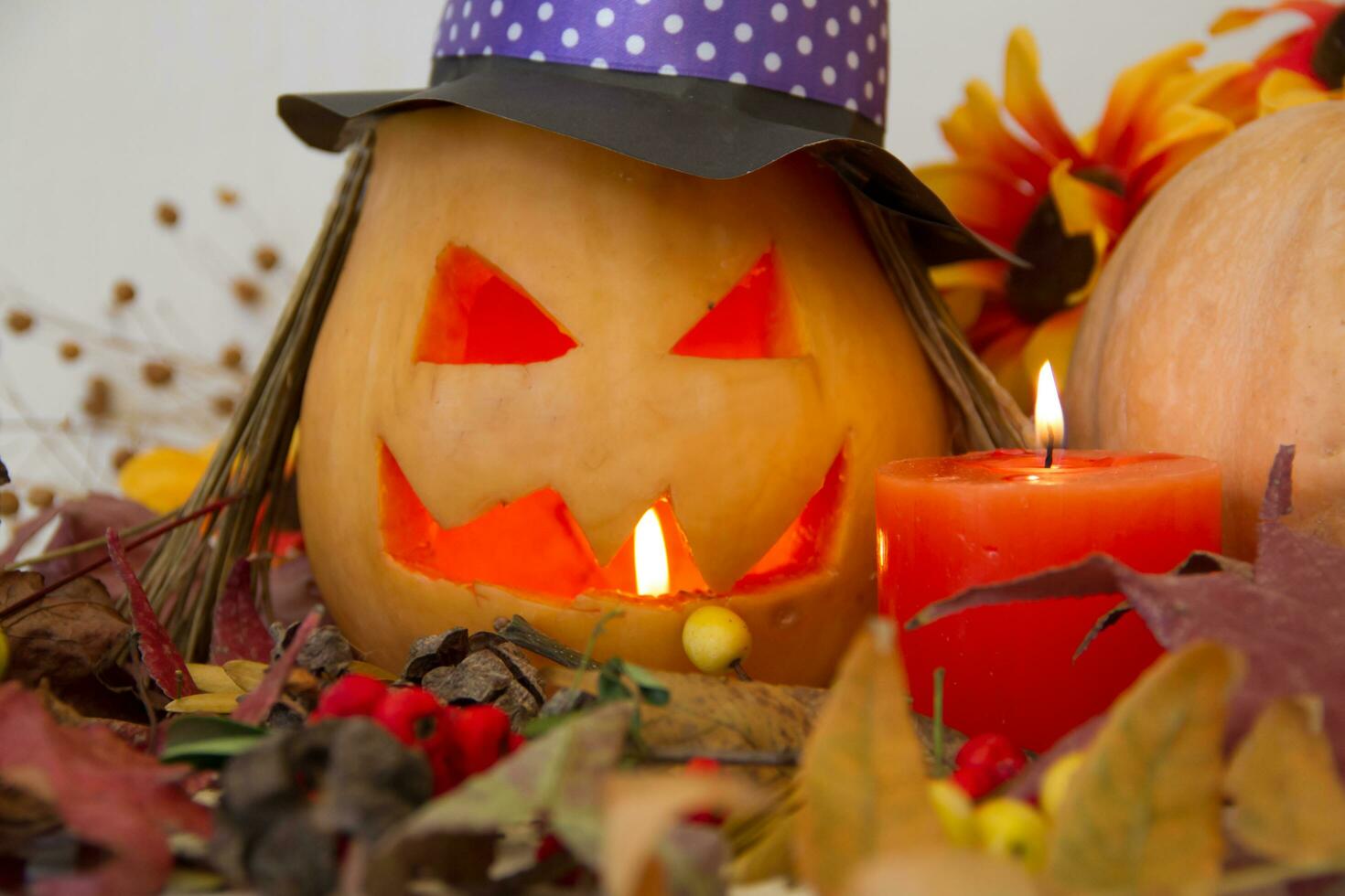 candles and decoration with halloween pumpkins with witch faces and witch photo