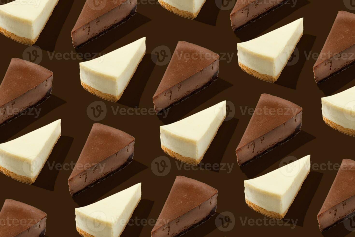 Vanila and chocolate piece slice cheesecake pattern on brown background isolated photo