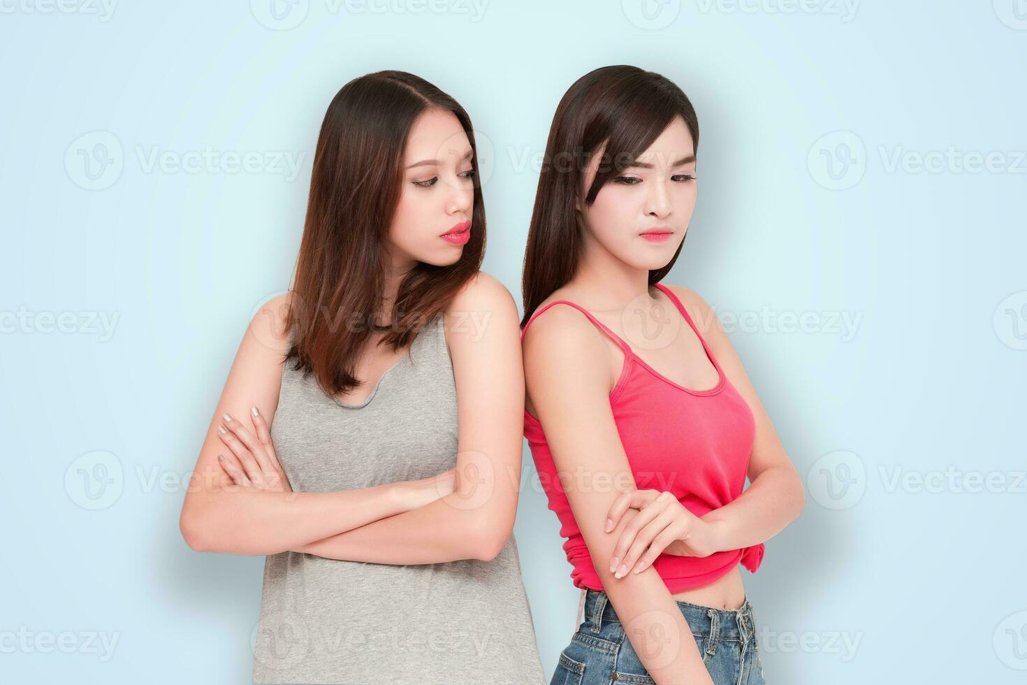 Two girls looking each other angry photo