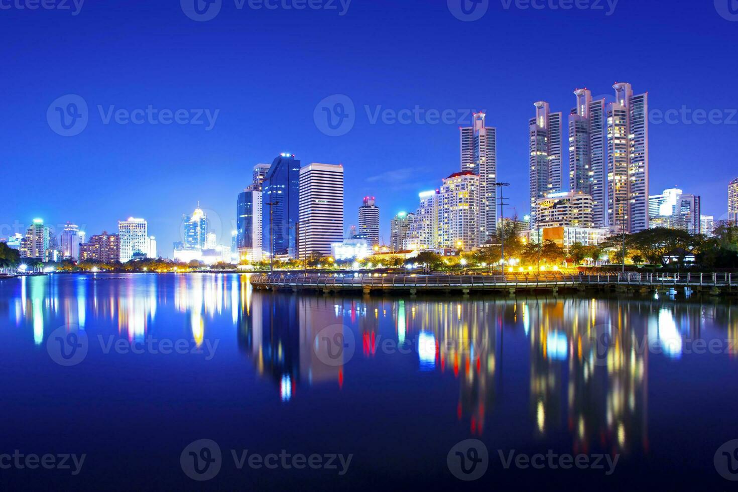 Bangkok, tall buildings and reflections at twilight photo