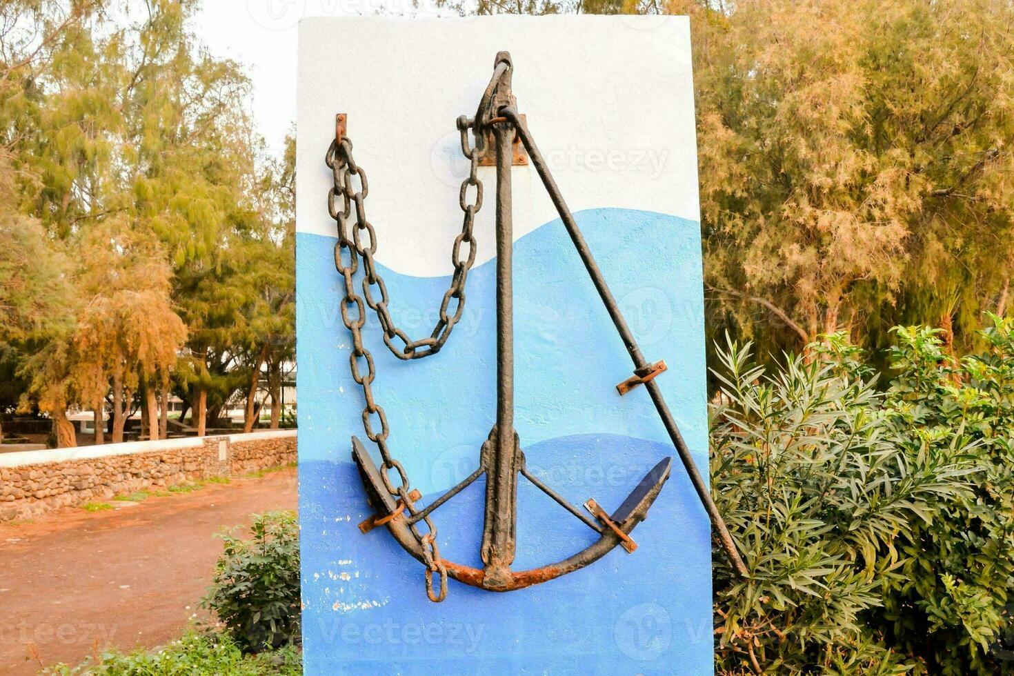 a sign with a rope and anchor on it photo