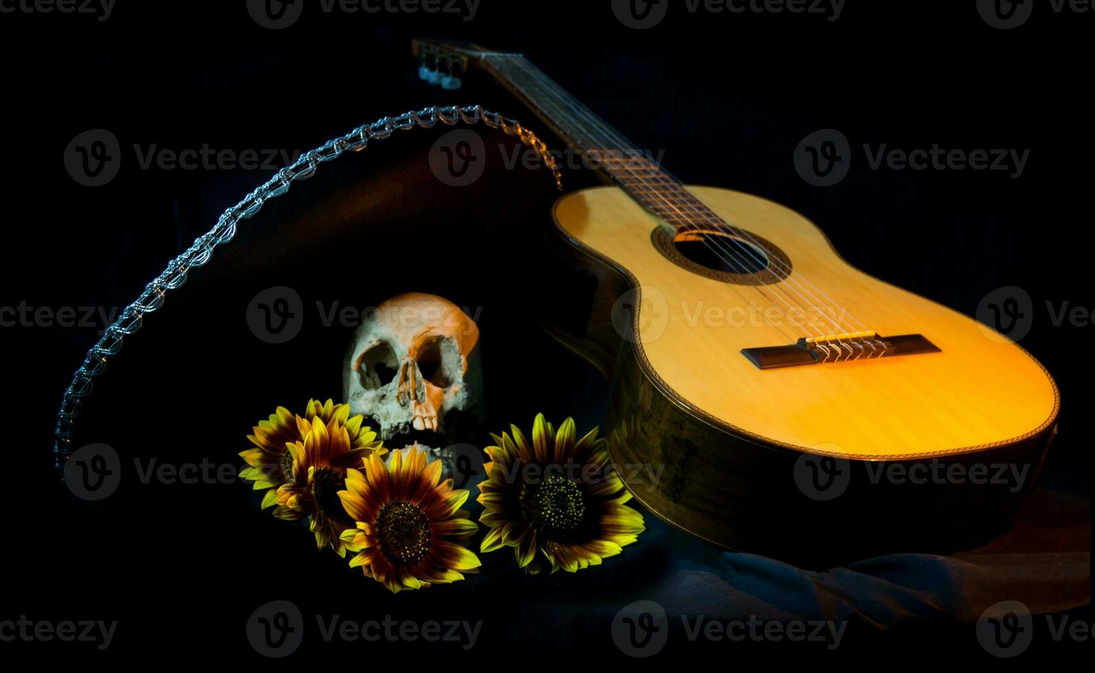 human skull, mexican hat, guitar and sunflowers photo