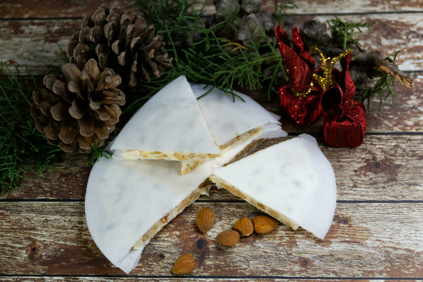 Almond nougat with Christmas decorations photo