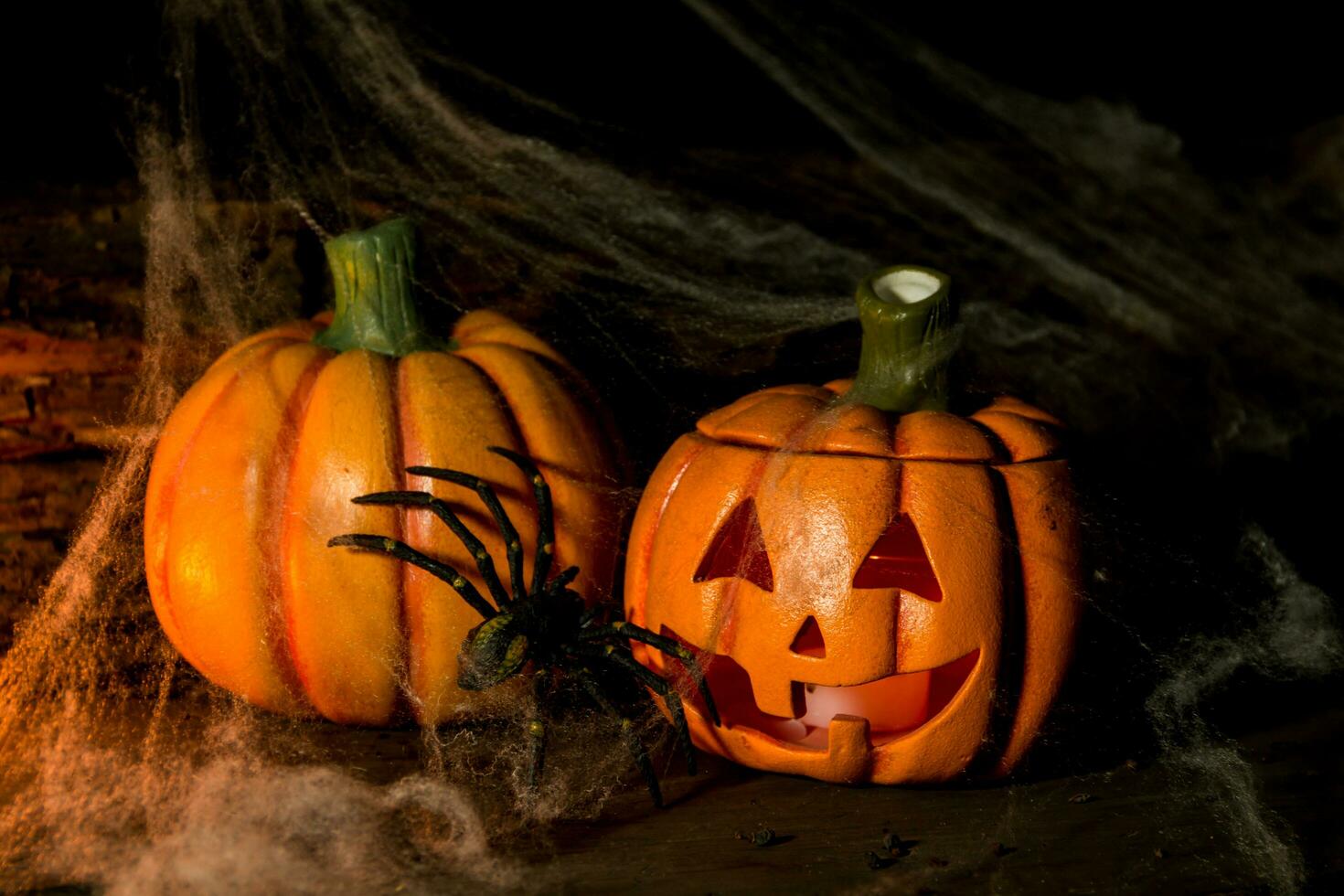 decoration for the celebration of hallowen with pumpkins, spiders, candles photo