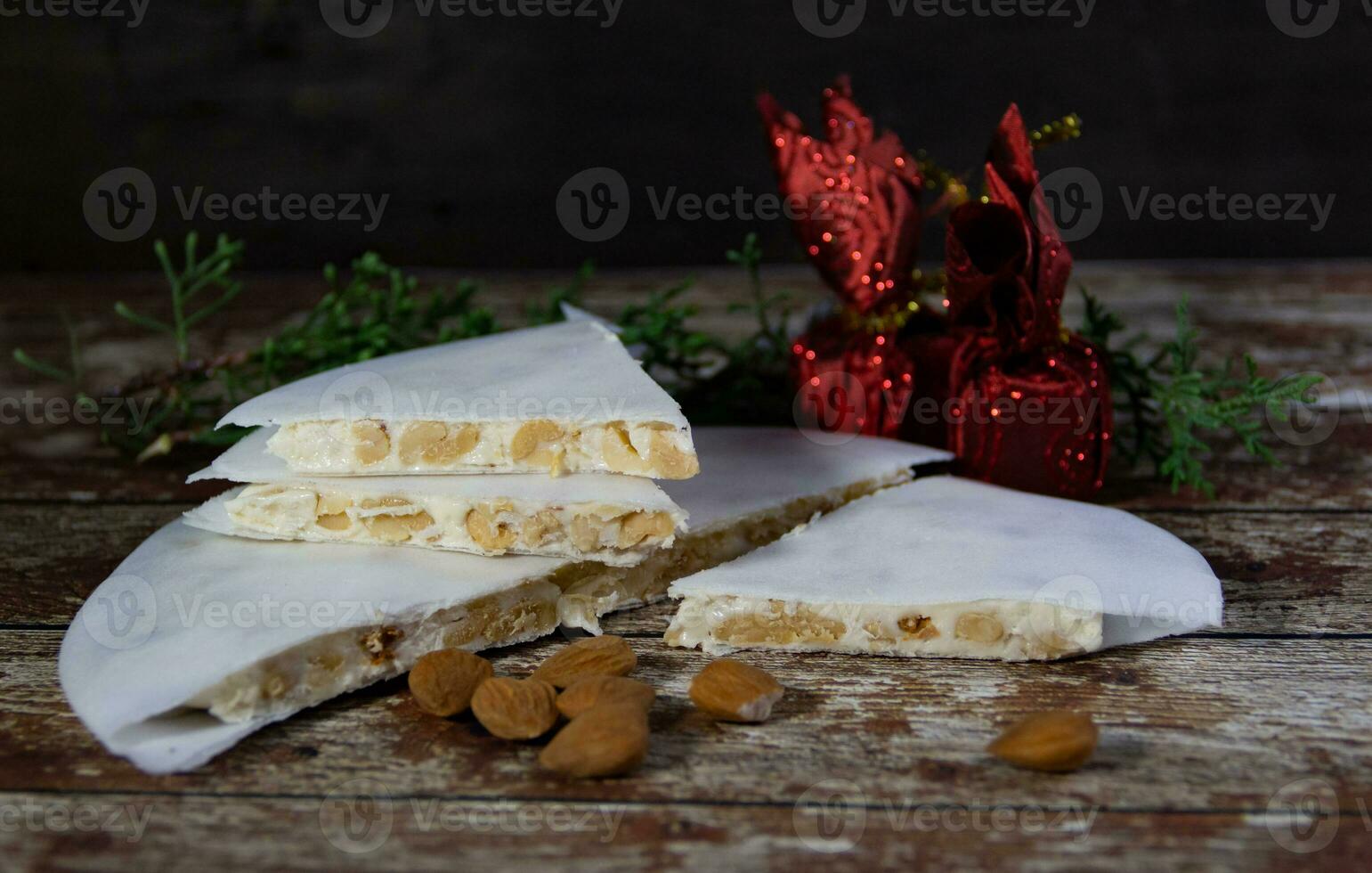 Almond nougat with Christmas decorations photo
