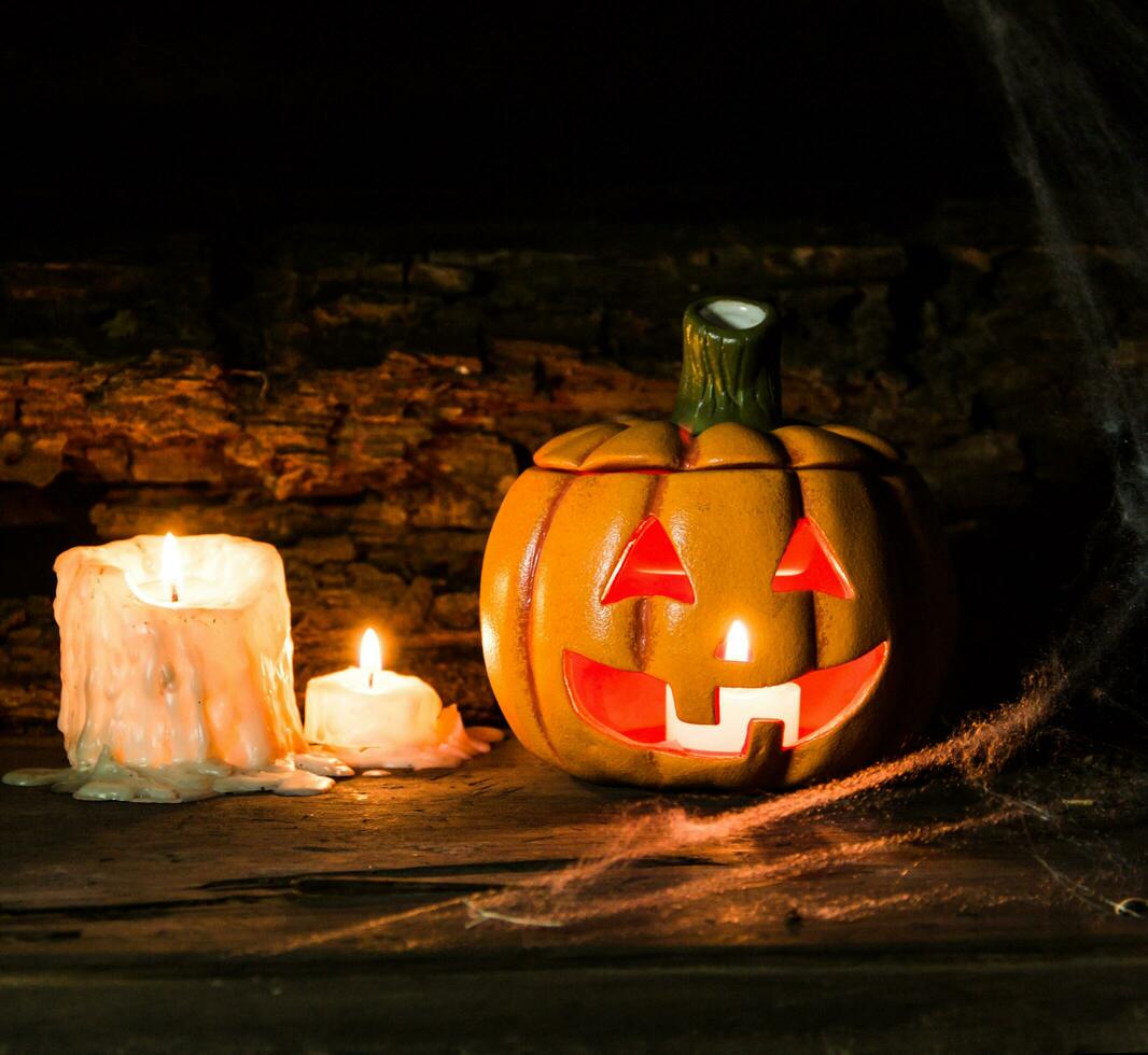 decoration for the celebration of hallowen with pumpkins, spiders, candles photo