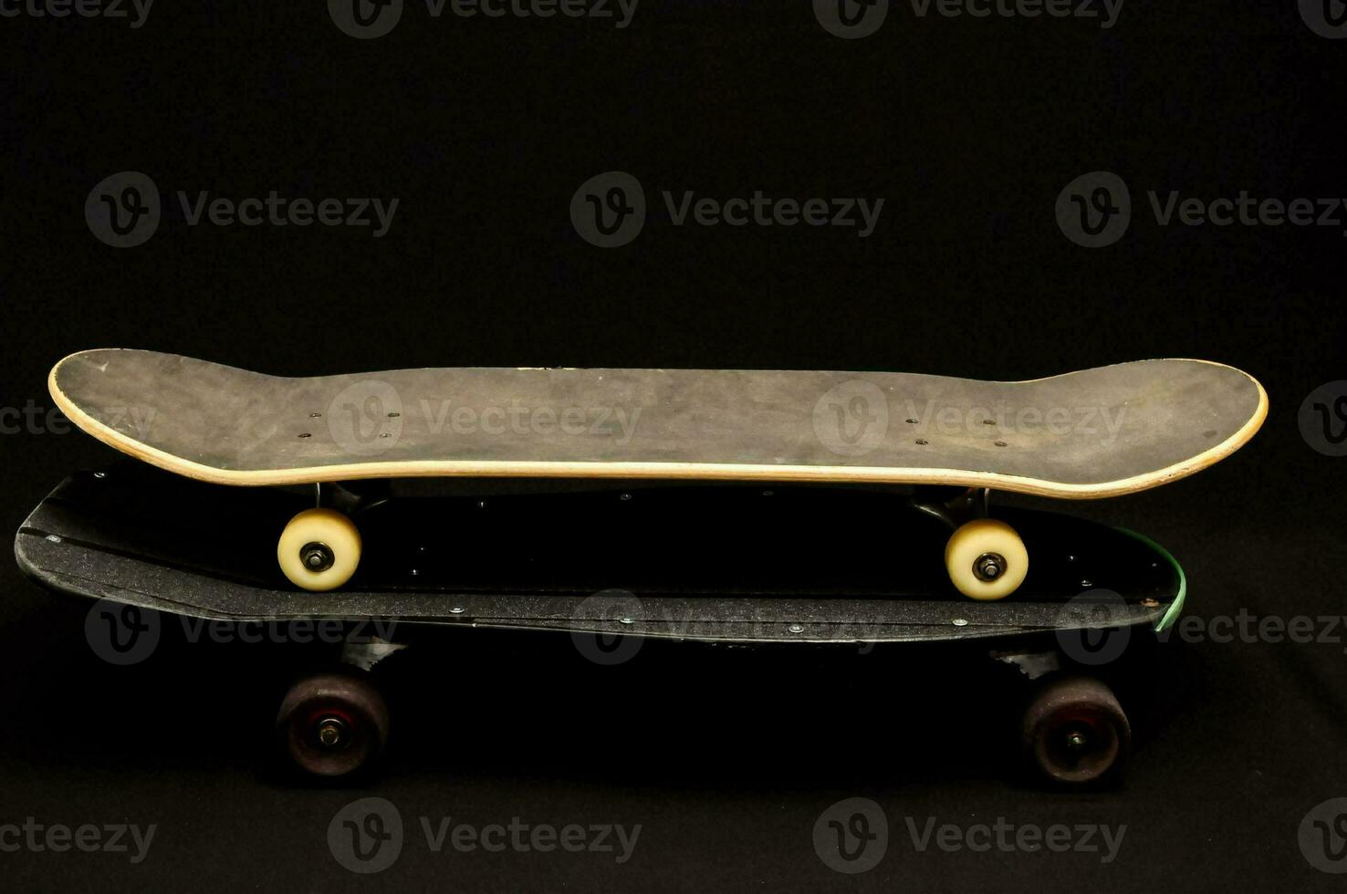 a skateboard with wheels on top of it photo