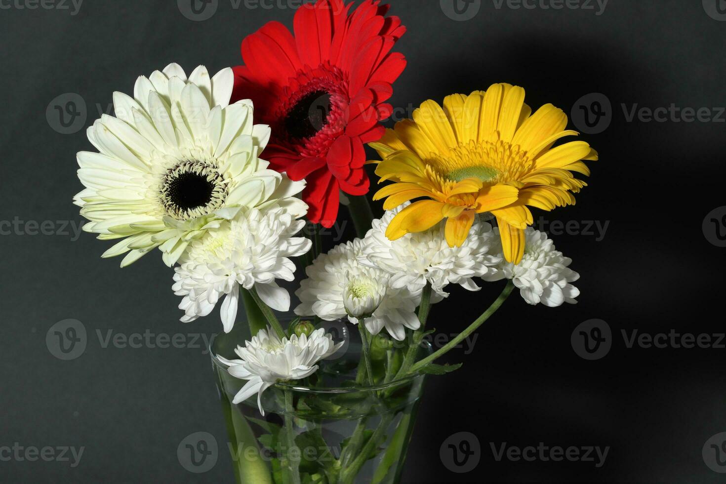 Bouquet of gerbera flowers on dark background photo