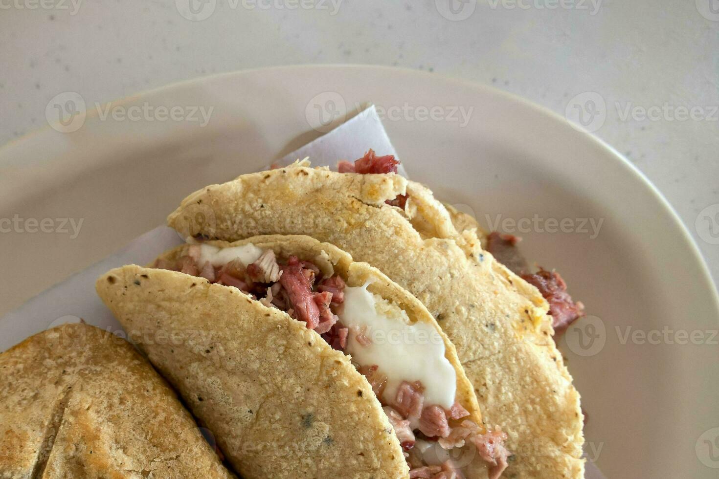 Pork carnitas tacos with handmade tortillas in Mexico photo