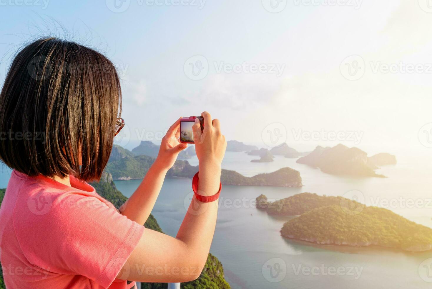 Woman on peak take photos