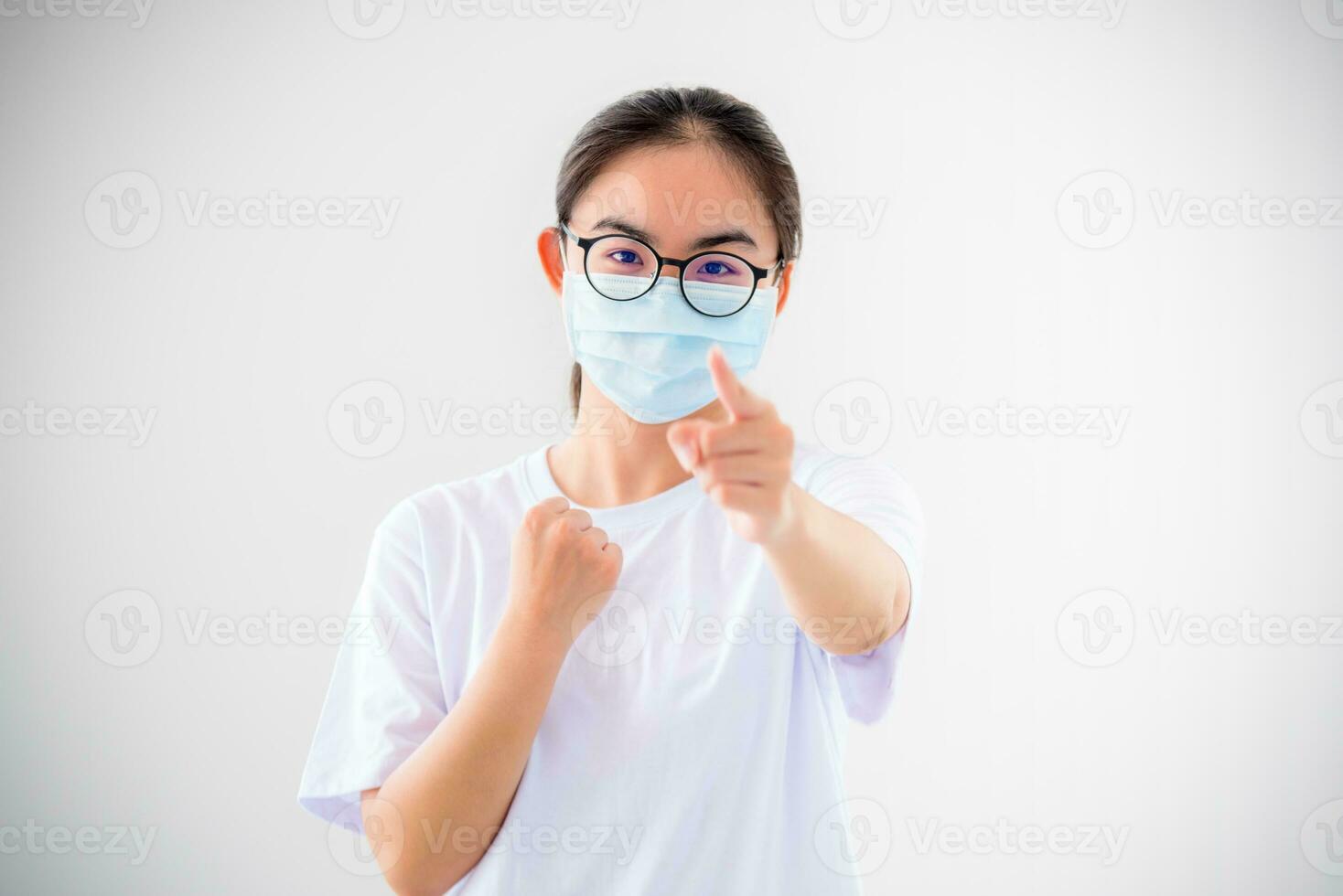 Woman raise fist and finger to show fighting photo