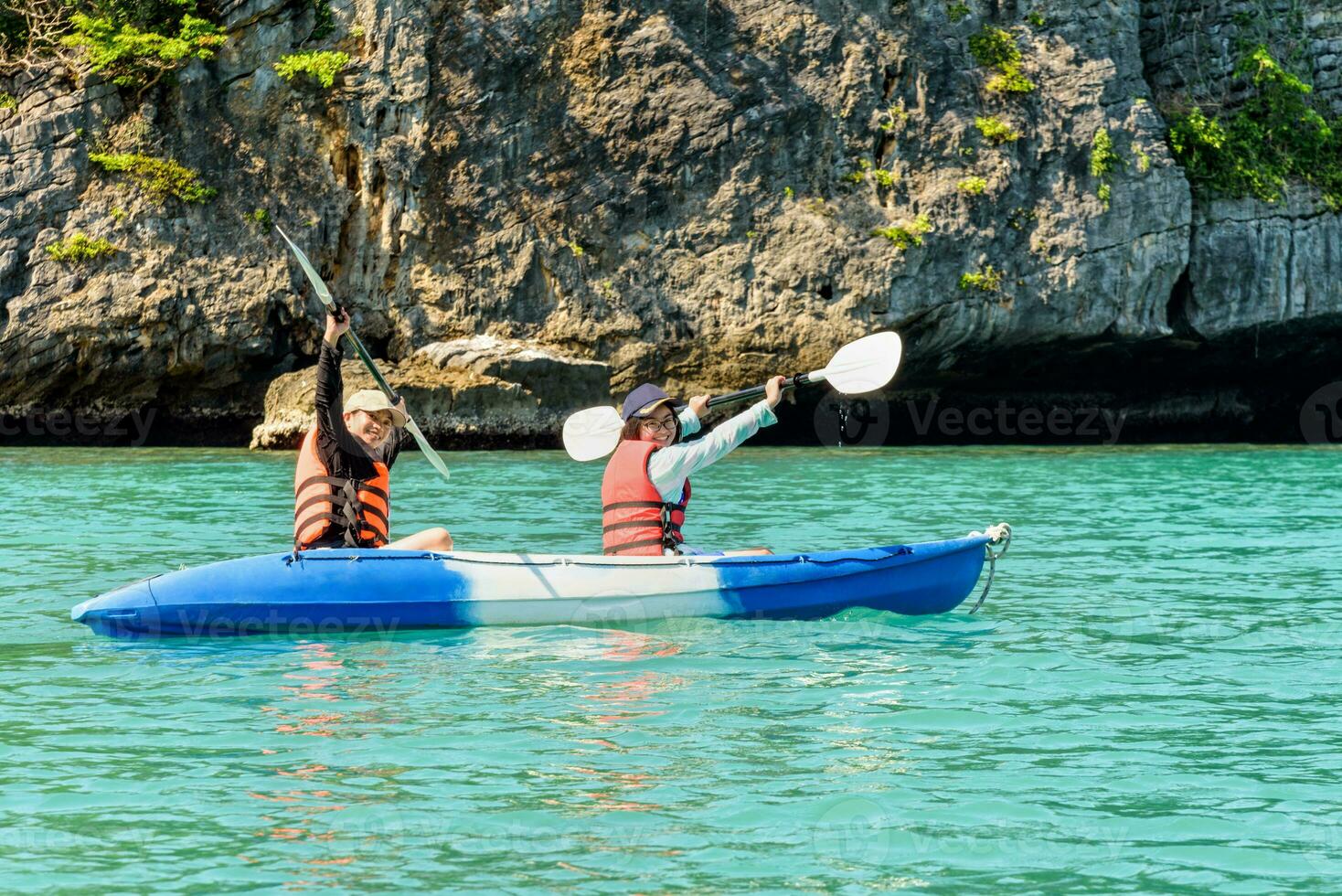 Travel by boat with a kayak photo