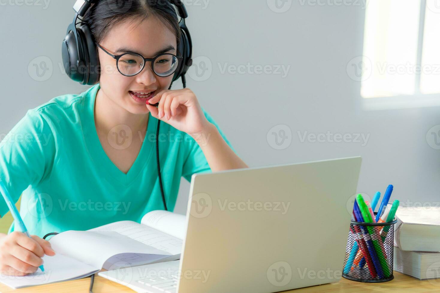 Students speak respond with microphone on a laptop photo