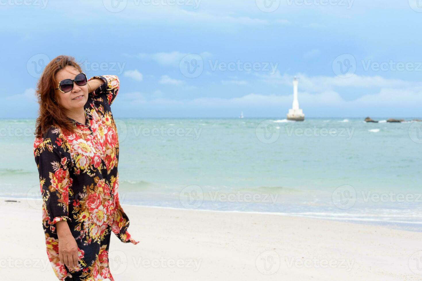 Middle-aged woman on the beach in Thailand photo
