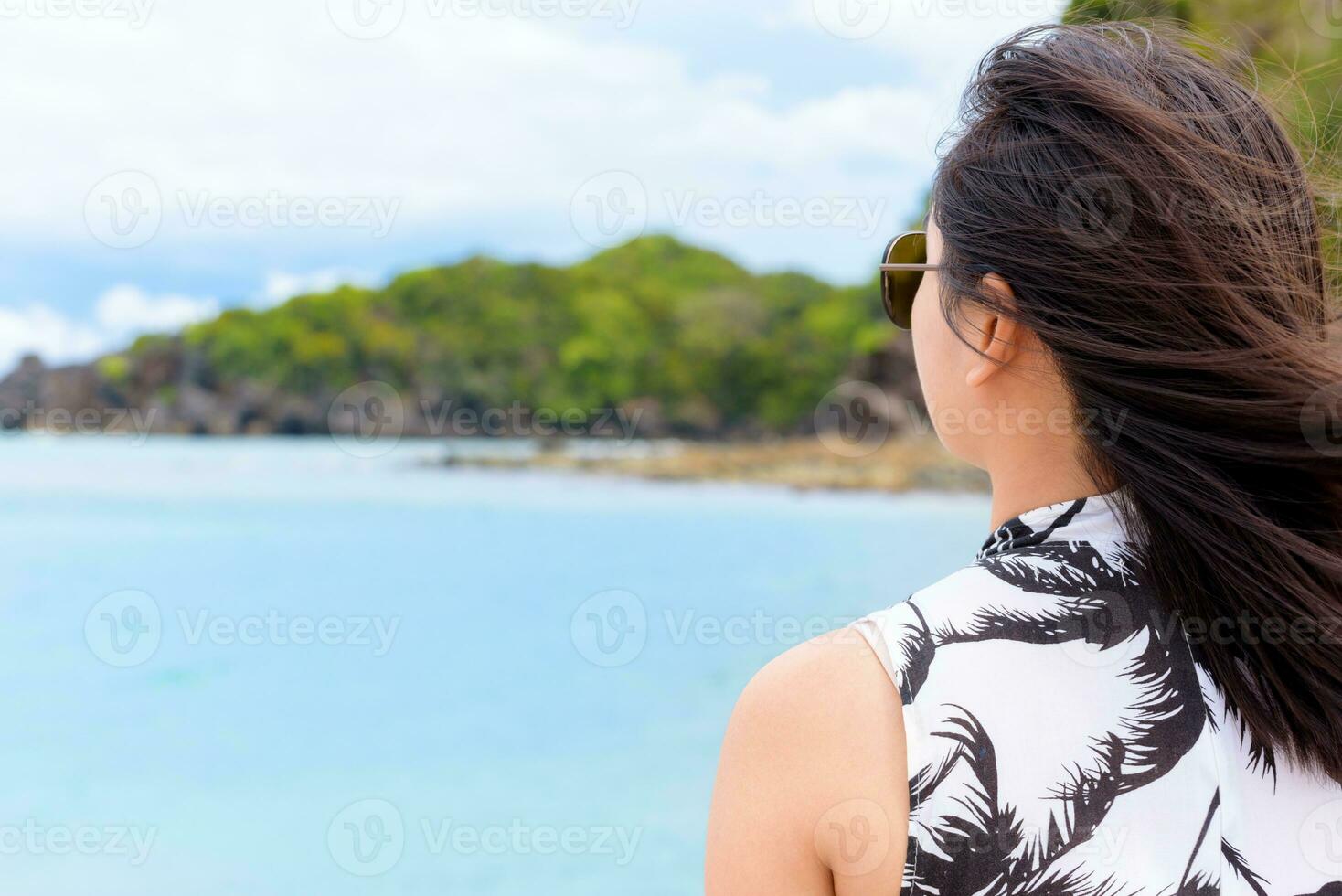 Woman tourist looking at the sea in Thailand photo