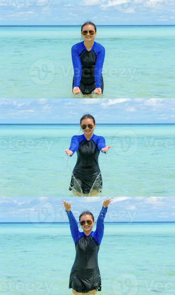 Happy asian teen girl play splashing water in the sea photo