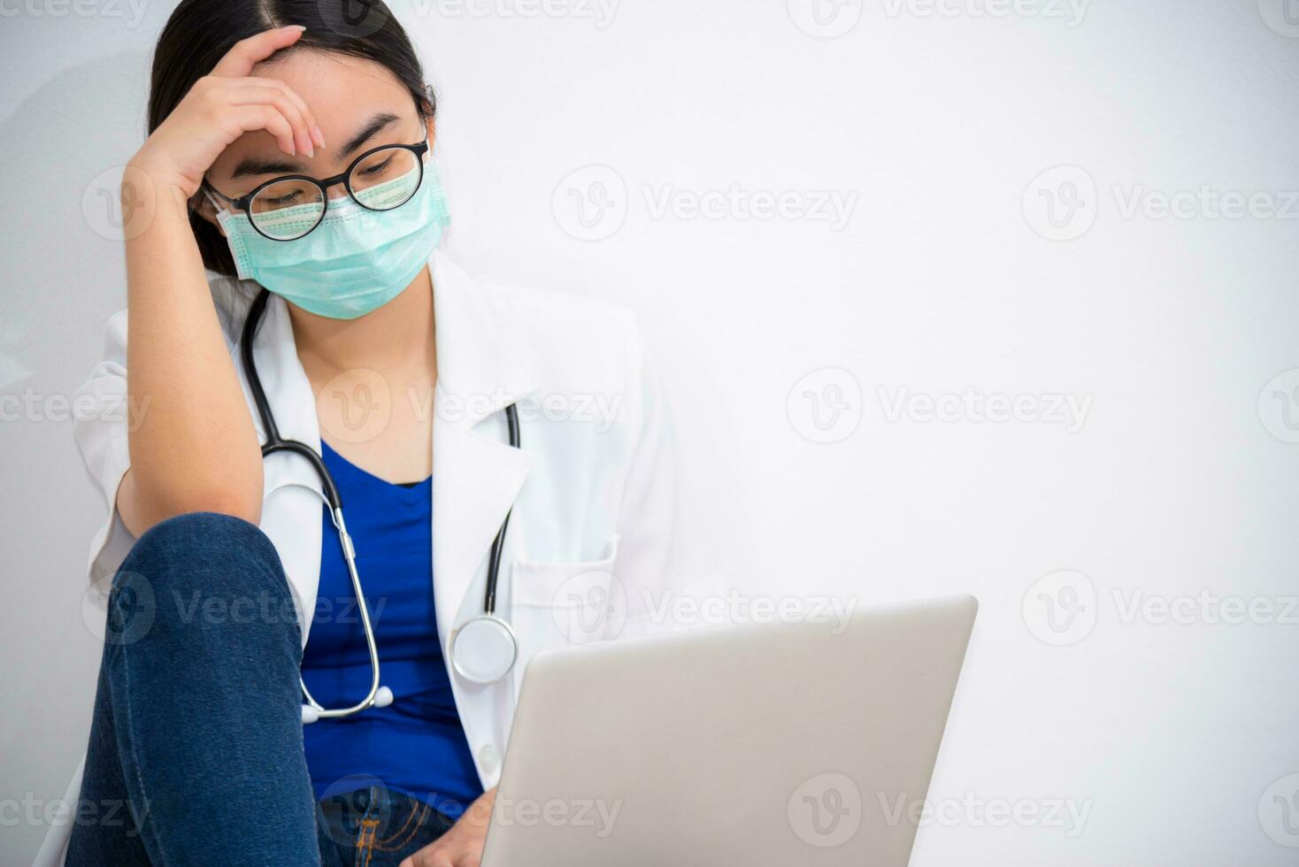 Doctor looking at the laptop with sadness photo