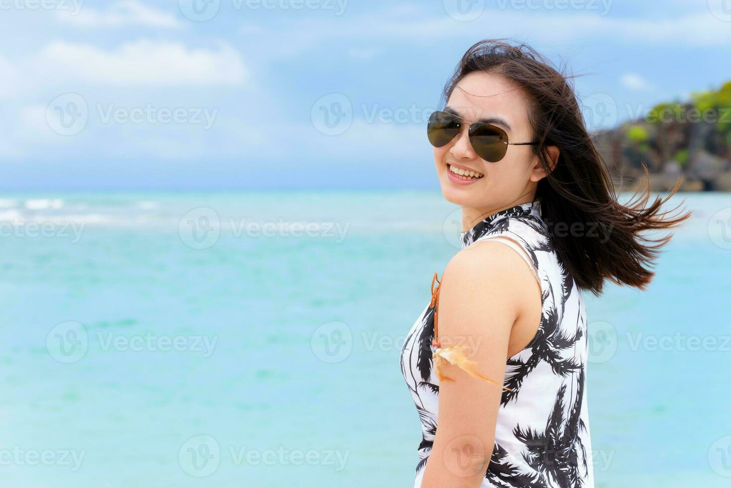 Beautiful woman tourist on the beach in Thailand photo