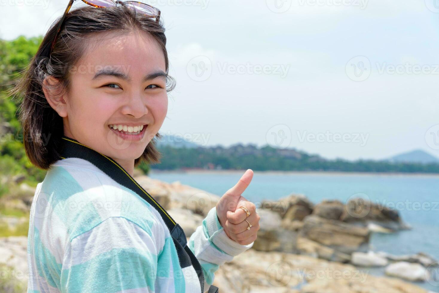 Young woman photography near the sea photo