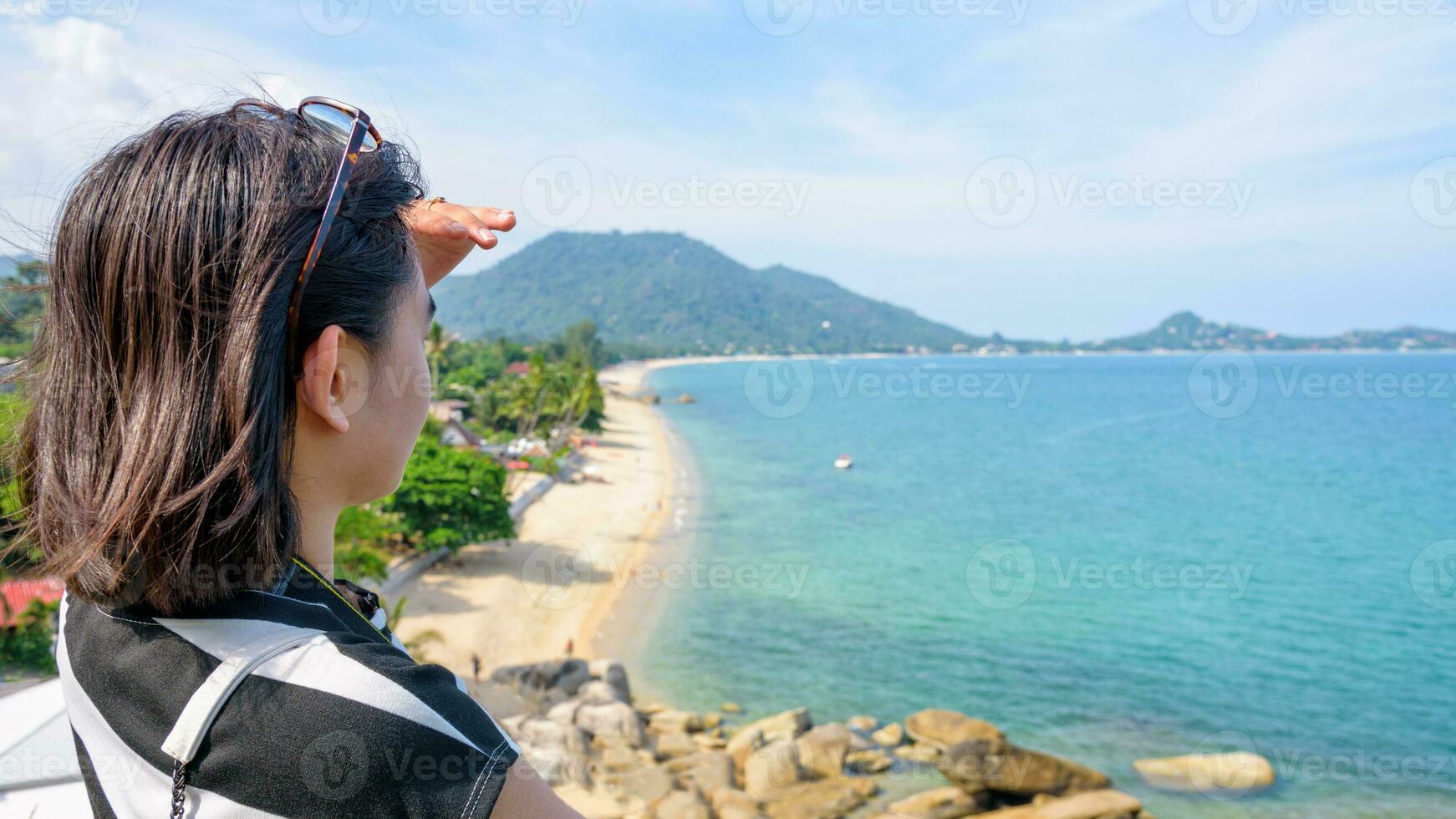 Woman tourist are looking at the sea photo