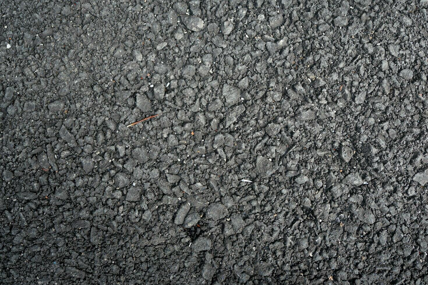 black asphalt background with sun rays photo