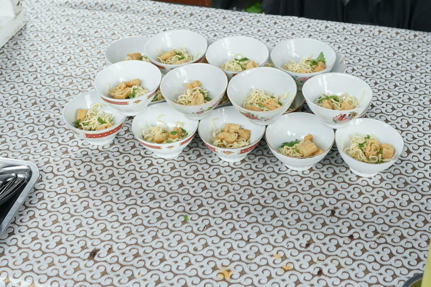 Soto ayam lined up in a bowl in a traditional event, traditional Indonesian food photo